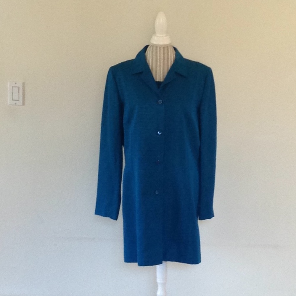 Tailored long silky coat with sleeveless sweater.